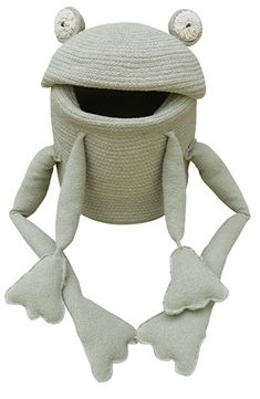 a knitted frog hat with two ears and eyes on it's head, sitting in front of a white background