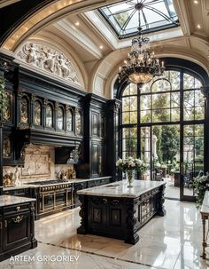 an ornate kitchen with black cabinets and marble counter tops