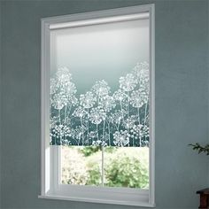 an open window with the blinds drawn in white flowers and leaves on it, next to a potted plant