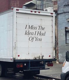 a large white truck parked on the side of a road