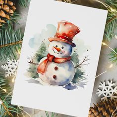 a watercolor painting of a snowman wearing a hat and scarf with pine cones around it