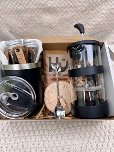 an open box containing coffee, tea and utensils