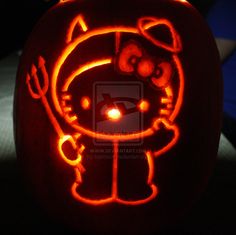 a hello kitty pumpkin carved into the shape of a cat