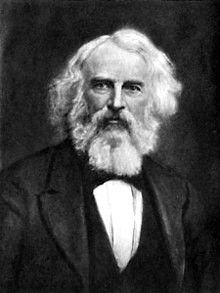 an old black and white photo of a man with a long beard wearing a suit