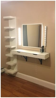 there is a white shelf with a mirror and lights on it in the corner of this room