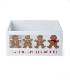 a white box with three gingerbreads on it