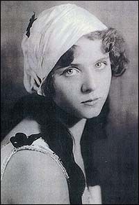 an old black and white photo of a woman wearing a turban