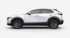 a white mazda cx - 5 parked in front of a white background with no people