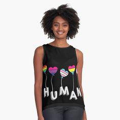 a women's tank top with the words human on it and balloons floating in the air