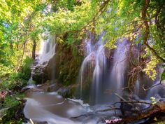 there is a waterfall in the woods