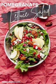 a salad with apples, spinach and feta cheese in a white bowl on a pink background