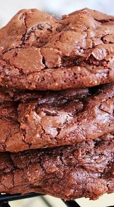 three chocolate cookies stacked on top of each other