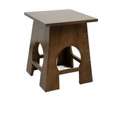 a small wooden stool with one foot in the center and two legs at the bottom