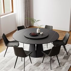 a black table with four chairs around it