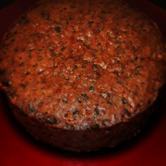 a chocolate cake sitting on top of a red plate