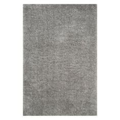 a gray rug on a white background with no one in it or someone else to the side