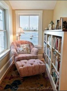 a living room filled with furniture next to a book shelf full of lots of books