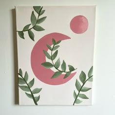 a painting on the wall with leaves and a pink moon painted on it's side