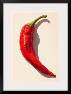 a red chili pepper on a white background framed in a black frame with a shadow