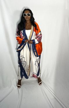 Rich Auntie at it's finest! Our fashion satin kimono can be worn as an oversized dress on it's own or cinched at the waist for a more fitted look. Flowy and colorful style definitely can make this a beach coverup or vacation look. In One Size fits most as the sleeves are open flowy and the kimonos have an open front. Size US Size One Size Long Satin Summer Robe, Chic Long Sleeve Satin Kimono, Spring Satin Kimono With Kimono Sleeves, Floral Print Satin Kimono, Spring Satin Kimono With Floral Print, Spring Floral Print Satin Kimono, Satin Kimono With Floral Print, Oversized Silk Kimono, Red Long Sleeve Spring Robe