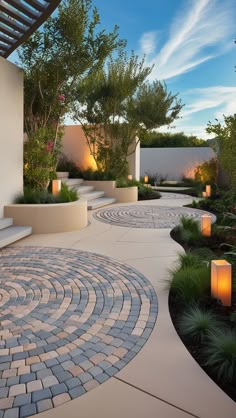 an outdoor walkway with lit candles in the center