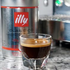 a cup of coffee sitting on top of a counter