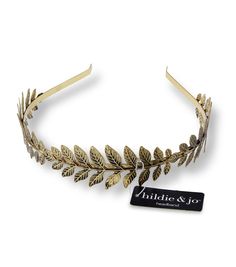 Make a Statement with the hildie & jo Antique Gold Iron Leaf HeadbandElevate your look and be the center of attention at your next event with this stunning hildie & jo Leaves Antique Gold Headband The intricate self - patterned leaves spread across the entire headband, adding a touch of elegance to any hairstyle The detailed stems add an extra layer of charm to this already gorgeous accessory Pair it with your favorite little black dress for a show - stopping lookProduct DetailsBrand: hildie & j Adjustable Gold Headband For Summer, Fancy Headbands, Leaf Headband, Leaves Headband, Chic Headband, Gold Headband, Gold Leaves, Joanns Fabric And Crafts, Craft Stores