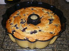 a blueberry bundt cake sitting on top of a pan