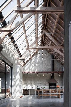 an open room with exposed ceilings and wooden beams