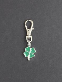 THESE ARE TINY CHARMS, PLEASE SEE PHOTOS FOR SIZE COMPARISON These sweet little, green enamel, four leaf clover zipper charms will look great on backpacks, jackets, purses, cosmetic bags, planners, laptop bags, or gym bags.  Metal and clasp are silver-tone.  Great for St. Patrick's Day! *The three leaves of a shamrock are said to stand for faith, hope and love. A fourth leaf is where we get the luck from! CHARMS ARE ONE SIDED. Lobster clasp  9mm x 23mm. Clasp base swivels 360 degrees. *INTENDED Tiny Charms, Faith Hope And Love, Lucky Elephant, Tiny Charm, Clover Green, Zipper Charms, Clover Necklace, Elephant Charm, Four Leaves