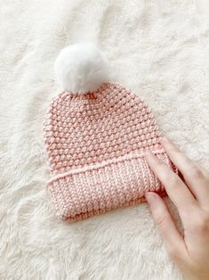 a knitted beanie with a pom - pom on top and text overlay that says, knitting pattern