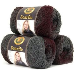 three skeins of yarn with the words scarffe on them in black and red