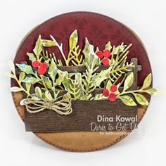 a close up of a card with flowers and leaves on it's back side