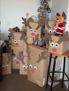 cardboard boxes with reindeer faces are stacked on top of each other