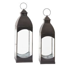 two metal lanterns with clear glass panels on the top and bottom, one is black