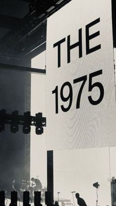 a large sign that reads the 1970 on it's side at an outdoor concert