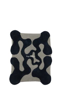 a black and white rug with an animal print on it's back side, in front of a white background