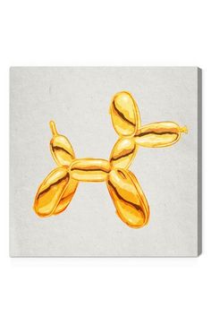 a gold balloon dog on a white background