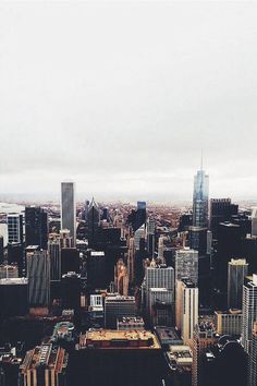 an aerial view of a city with skyscrapers and other tall buildings in the background