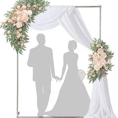 the shadow of a bride and groom holding hands in front of a wedding arch with flowers