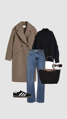 a woman in black and brown outfit with coat, shoes and handbag on grey background