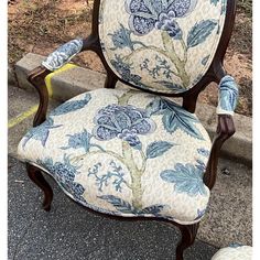 This is an early 20th century French carved fruitwood bergere  chair newly upholstered in a blue floral with neutral leopard background. The fabric is linen. The stool came with the chair but is not quite as old as the chair nor the same wood. It measures 16”L x 11”W x 8”H. The arm height of the chair is 26”. Antique Arm Chair, Kitchen Townhouse, Blue Floral Accent Chairs For Living Room, French Blue Chairs, French Bergere Chairs Upholstery, Floral Print Chair, Blue Toile Ottoman, French Country Color Palette, Purple Floral Upholstery