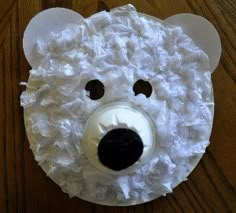 a white bear made out of toilet paper