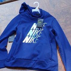 Blue Therma Hoodie By Nike New With Tags Nike Fleece Top With Adjustable Hood, Nike Fleece Hooded Top, Nike Hooded Fleece Top, Nike Hooded Tops With Adjustable Hood, Blue Fleece Sportswear Top, Blue Long Sleeve Sports Hoodie, Nike Blue Hoodie For Fall, Blue Nike Hoodie For Fall, Nike Blue Hoodie With Adjustable Hood