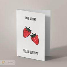 a greeting card with two strawberries on it, says have a berry special birthday