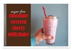 a hand holding a drink with chocolate covered cherry milkshake in it and the words sugar - free chocolate covered cherry milkshake