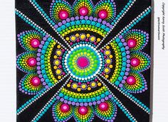 this is an image of a colorful art work with dots and circles on black paper