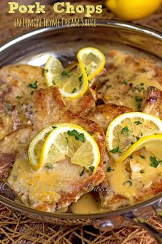 pork chops with lemon and thyme cream sauce in a skillet on a table