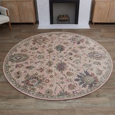 a large round rug in front of a fireplace