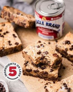 chocolate chip cookie bars on a cutting board next to a can of eagle brand